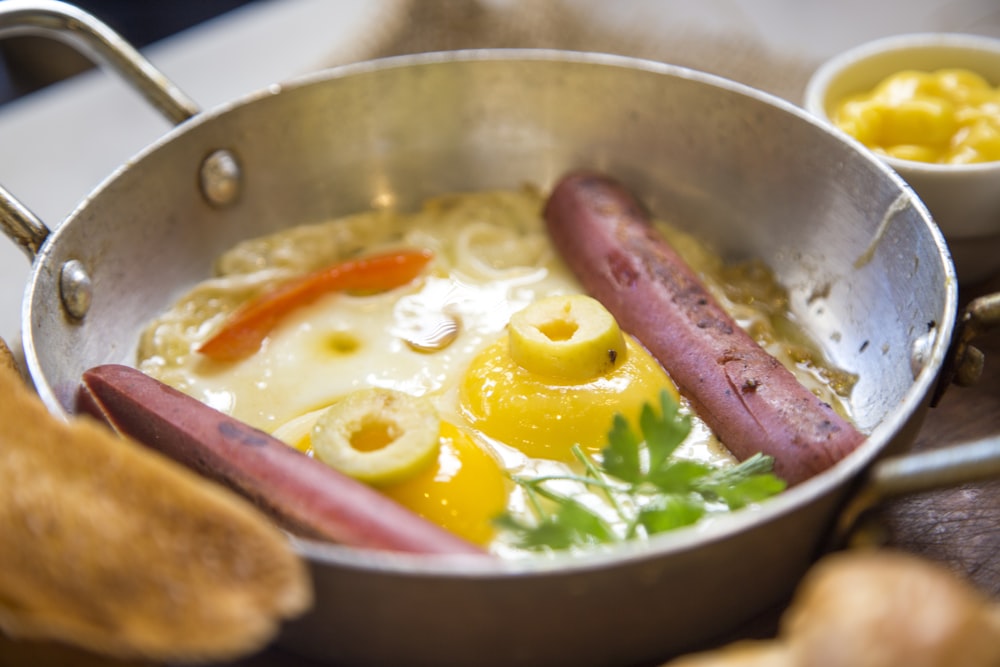 hotdog with eggs and parsley in bowl