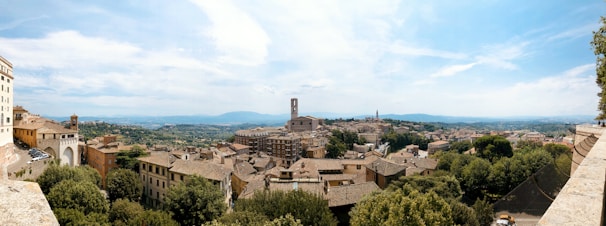 A panoramic view of Paperino village with its historic buildings and surrounding Tuscan landscape.
