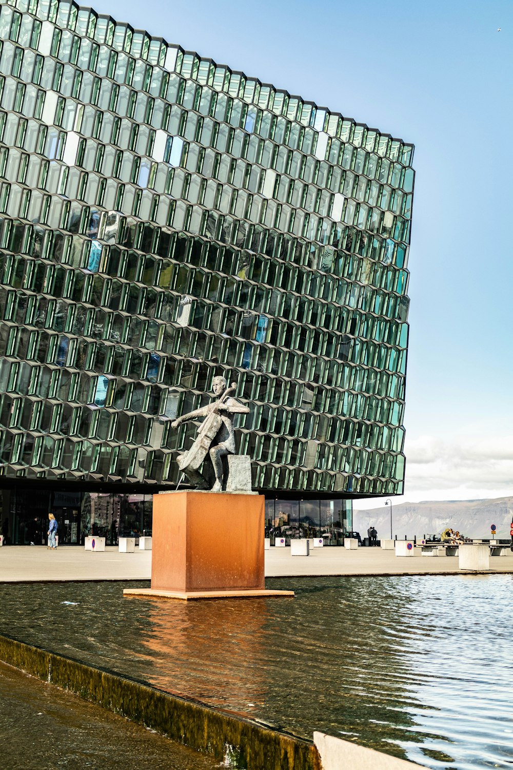 man playing instrument statue