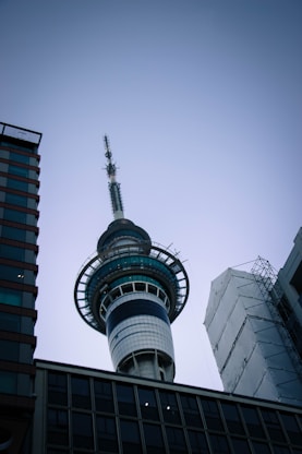 a tall tower with a sky scraper on top of it