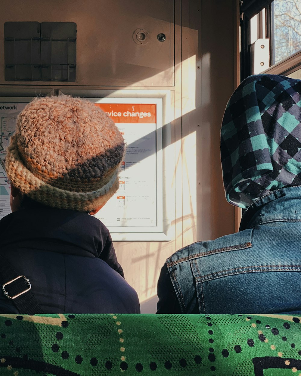 two man facing on wall at daytime