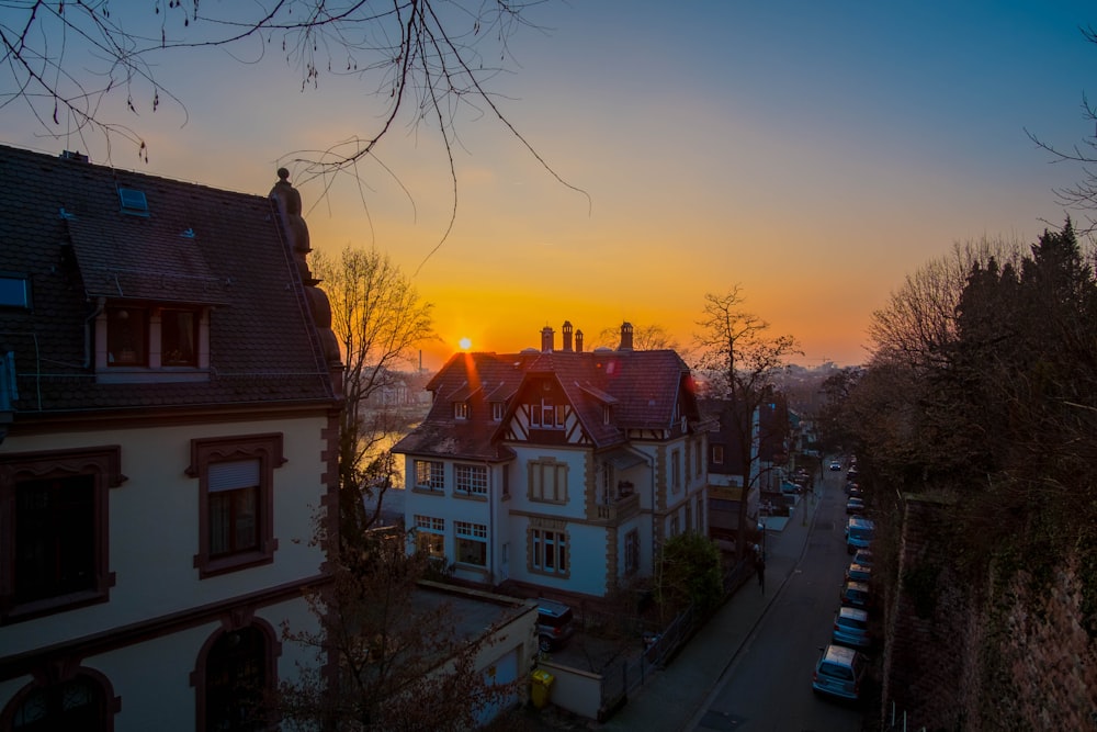 white and black houses at golden hour