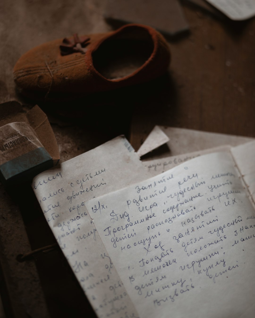 Children's notebook and a tiny shoe found in abandoned kindergarten in Chernobyl Exclusion Zone.