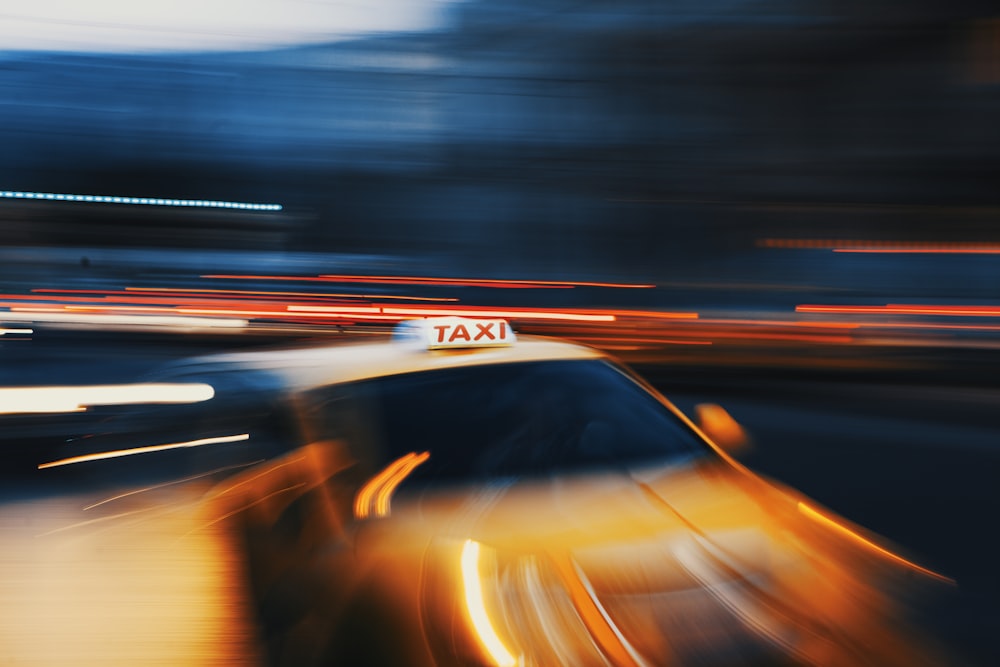 timelapse photography of orange vehicle