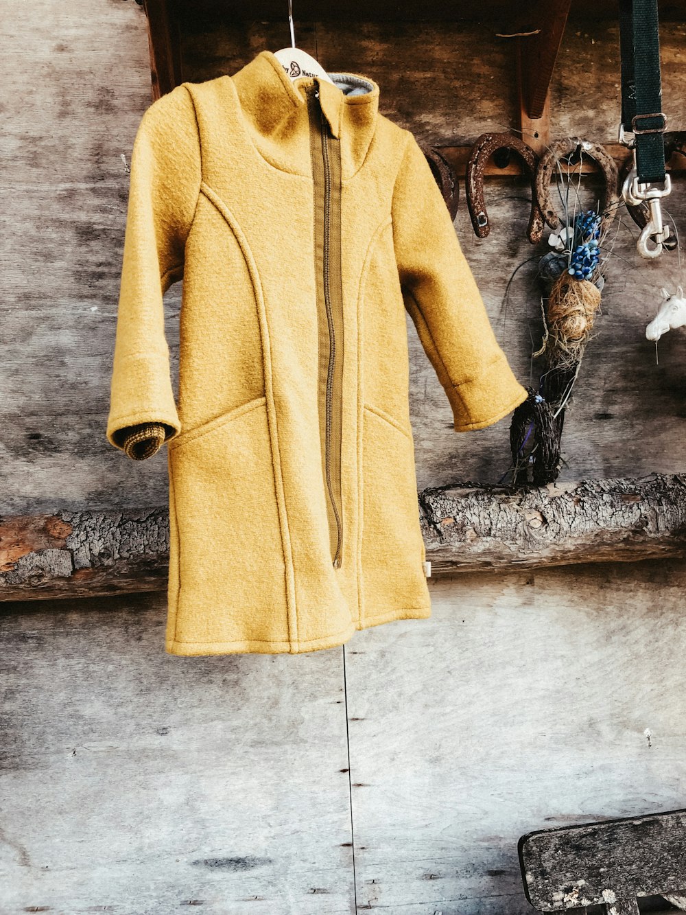 hanged yellow coat