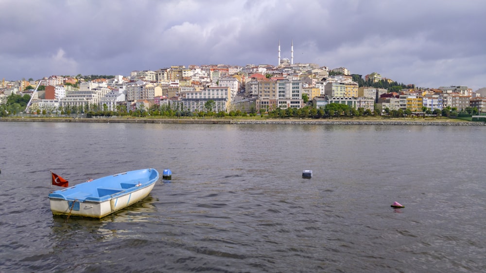 blue boat on calm water