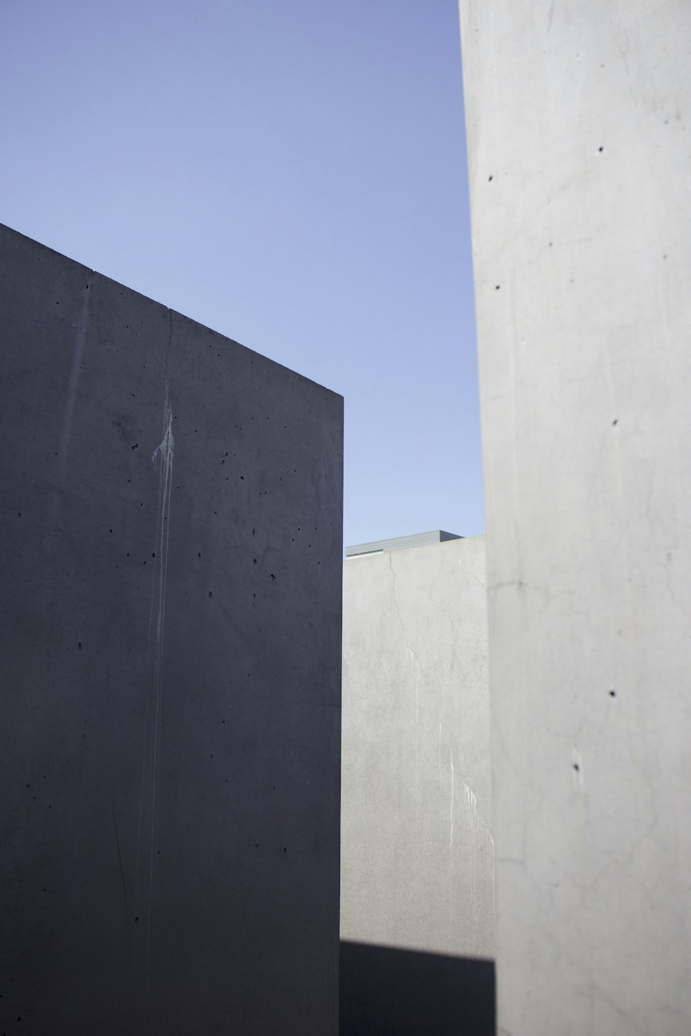 black concrete building under blue sky during daytime