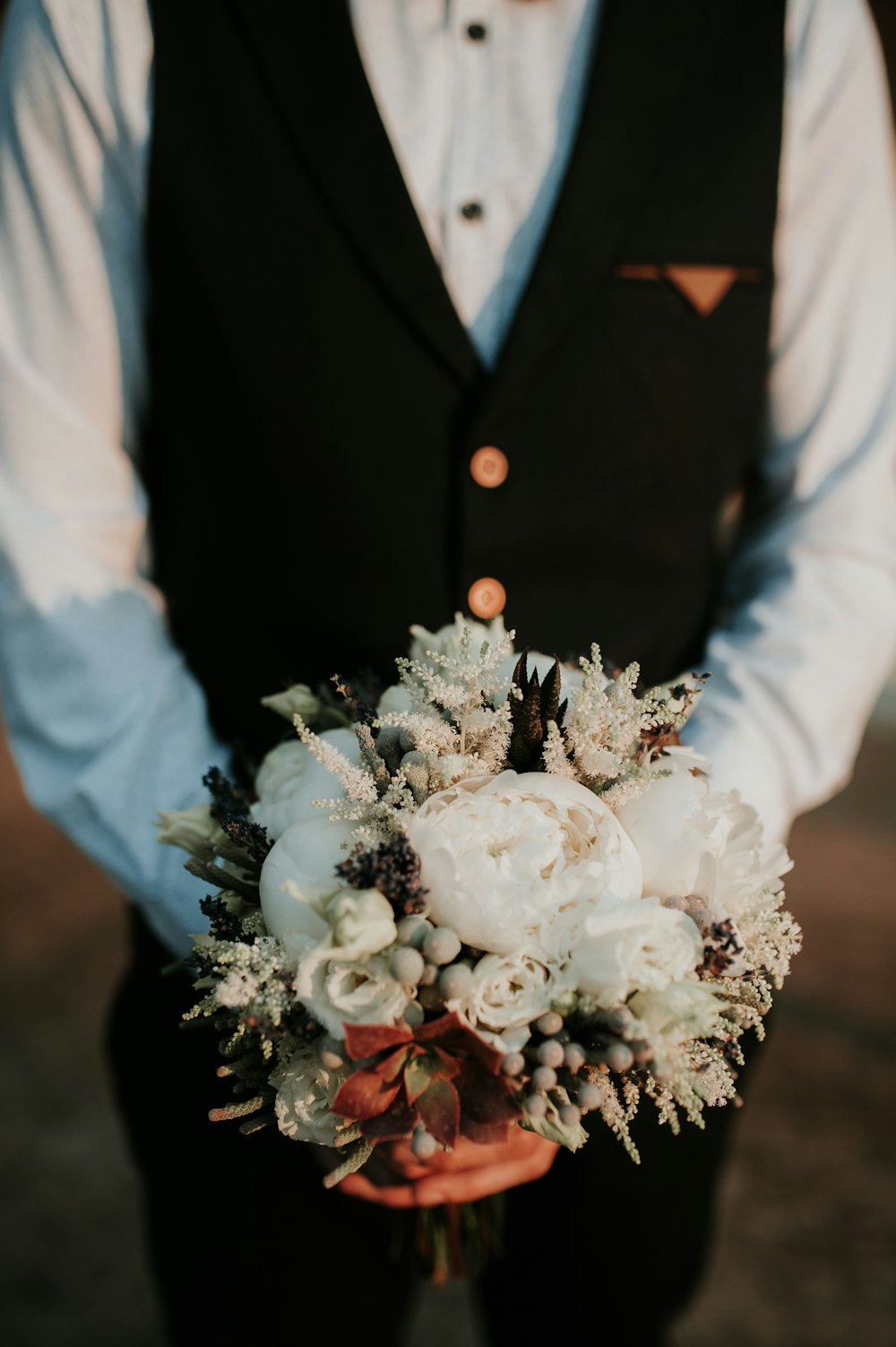 man holding flowers