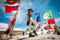 woman standing near flags
