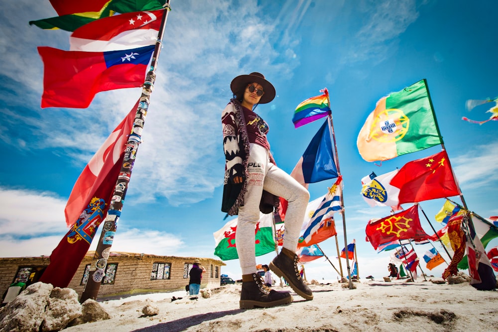 woman standing near flags