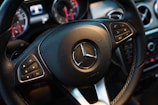 black Mercedes-Benz steering wheel