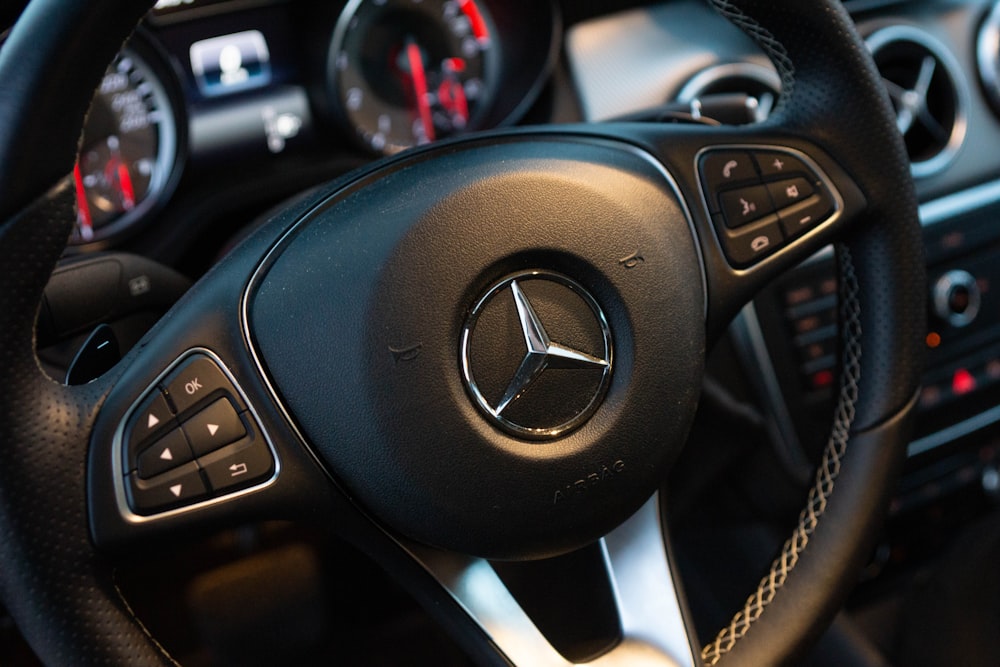 black Mercedes-Benz steering wheel