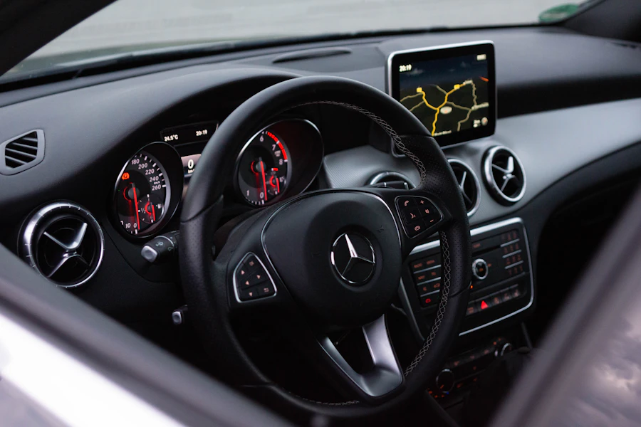 Premium car interior — Lexus / Tesla / Mercedes badge or cabin.