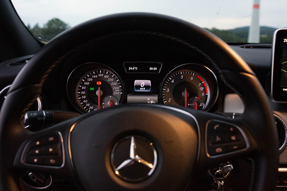 black Mercedes-Benz steering wheel