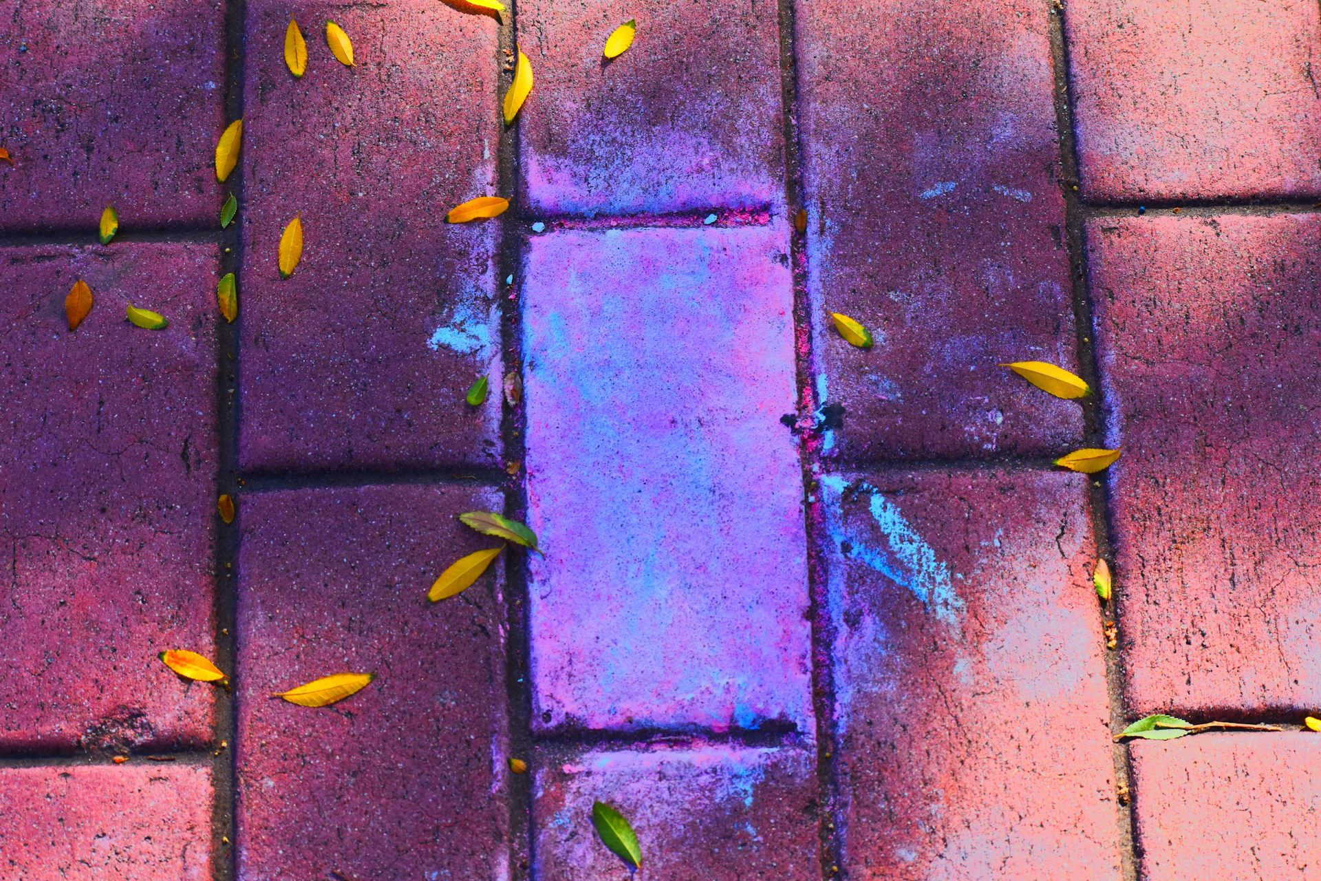 Before and after photo of a driveway transformation showcasing sleek concrete work with turquoise accents.