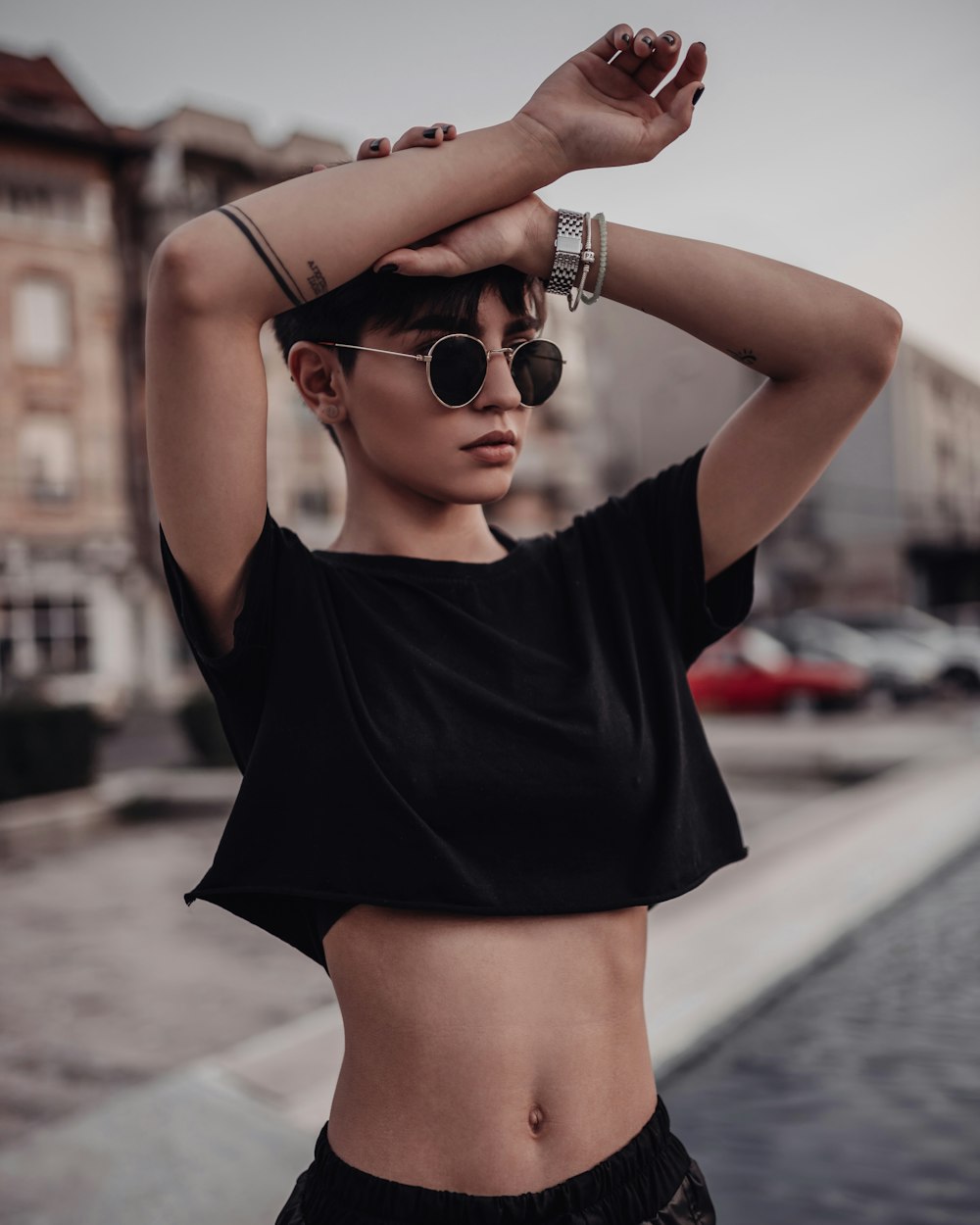 a woman wearing sunglasses and a black top