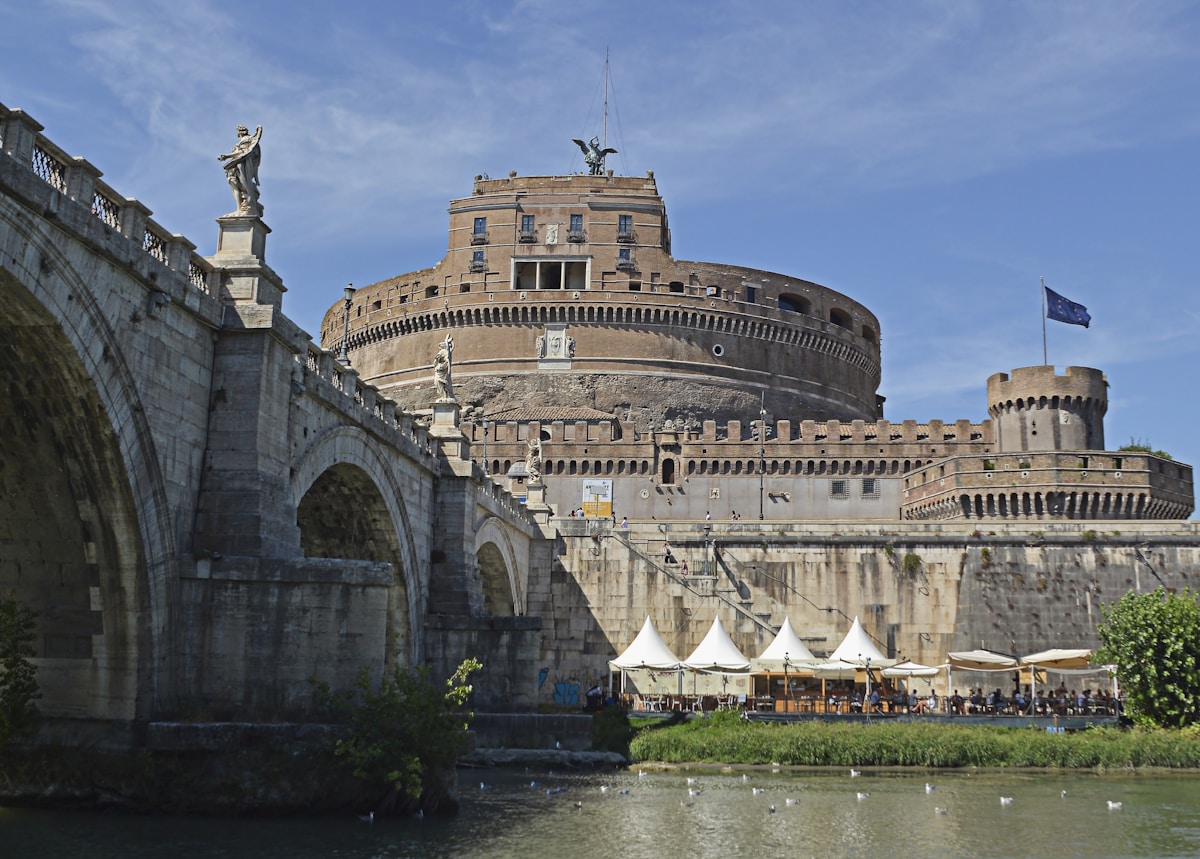 Castel Sant'Angelo and the Tiber river at sunset — the landmark that defines the Prati neighbourhood in Rome