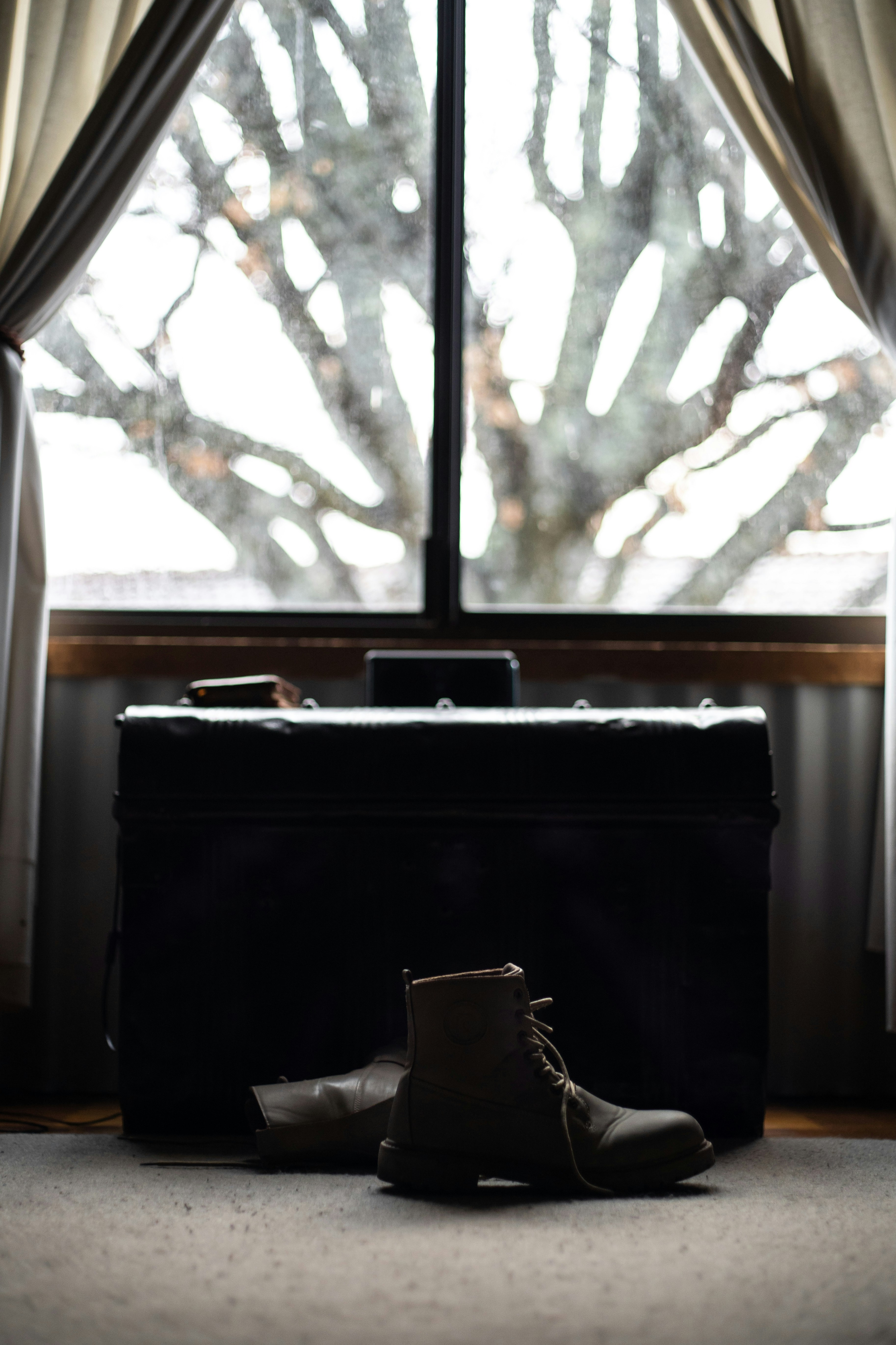 unpaired brown leather boot