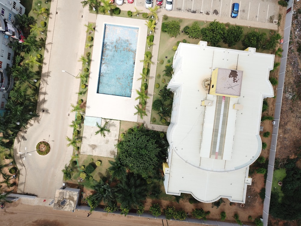 an aerial view of a building with a swimming pool