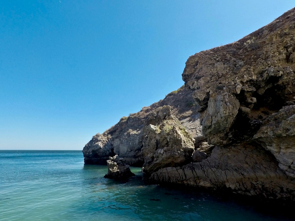 stone and body of water