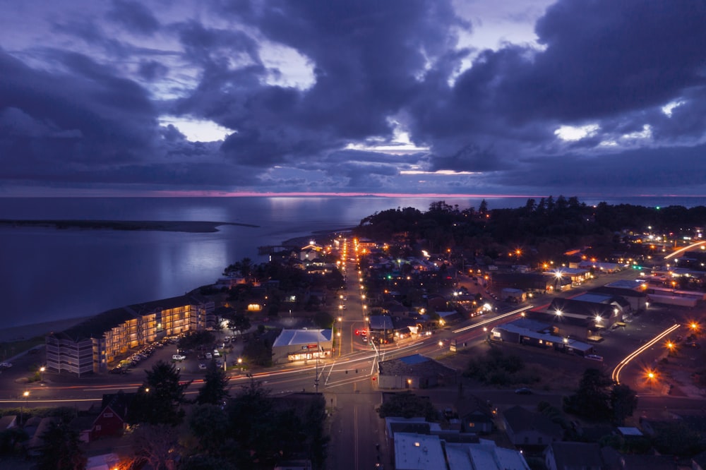 lighted buildings and road during nighttime