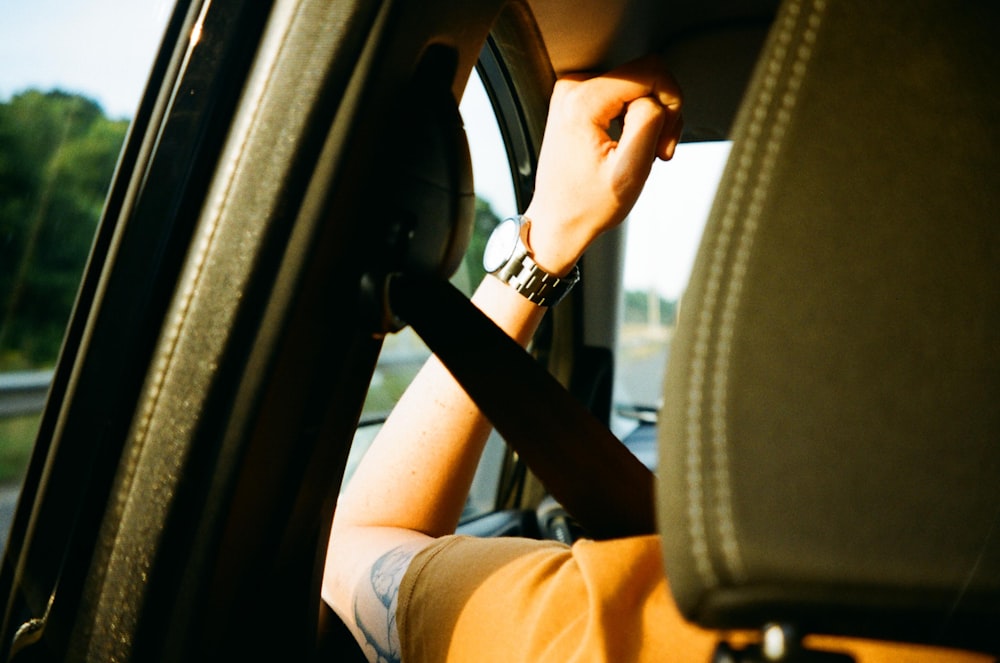 person sitting inside car during day photo – Free Cushion Image on Unsplash