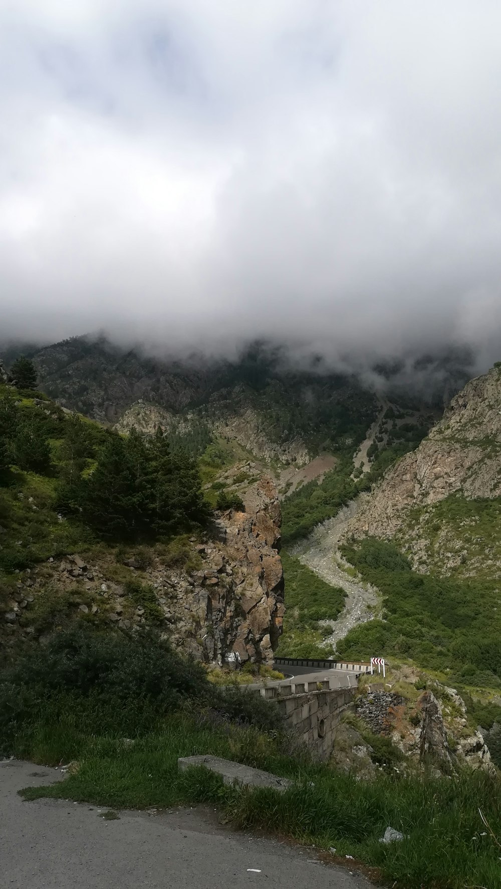 aerial photography of mountains under cloudy sky