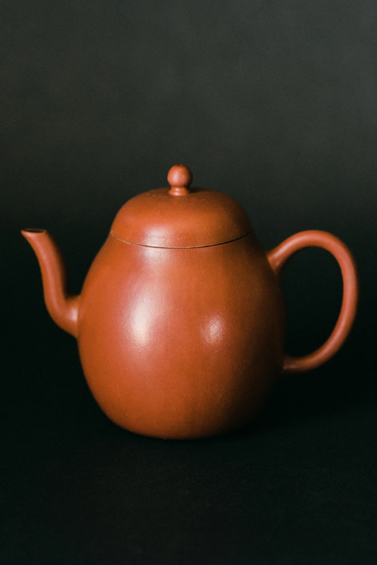 A red Yixing clay teapot