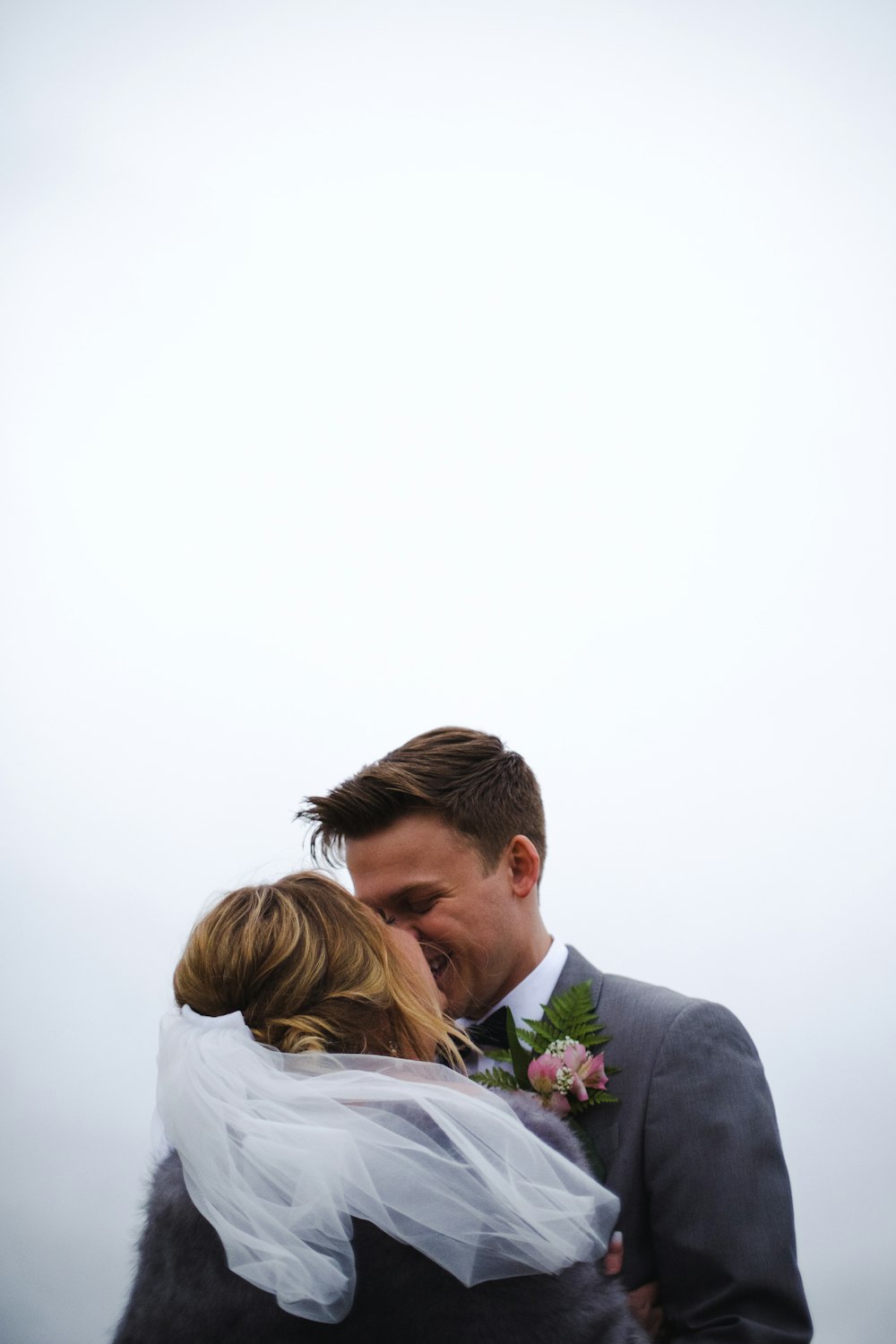 bride and groom kissing