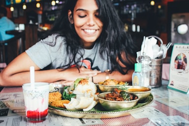 photography poses for dining,how to photograph picture by, lawrence vinay.; woman wearing grey shirt