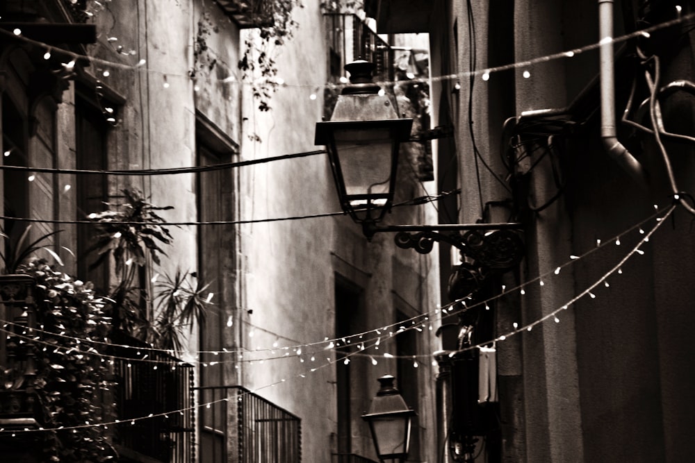 a black and white photo of a narrow alleyway