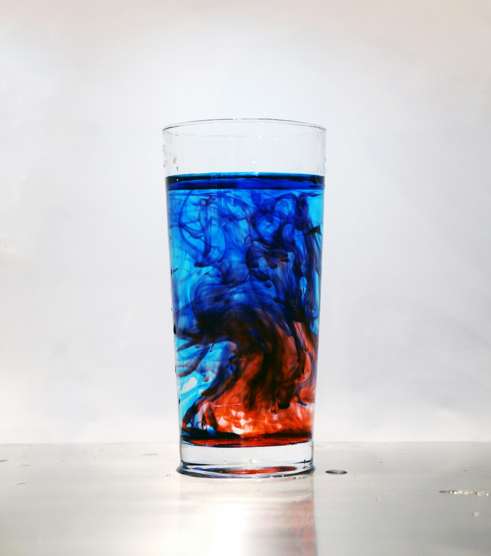blue and red highball glass
