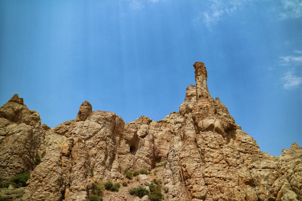 rocky outcrop under blue sky