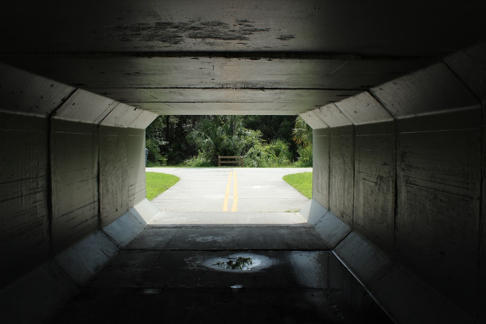 a tunnel with a road going through it