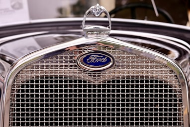 closeup photography of vintage black Ford vehicle