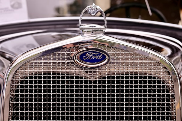 closeup photography of vintage black Ford vehicle