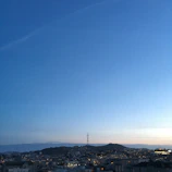 Panoramic view of a city skyline at dusk symbolizing global reach.