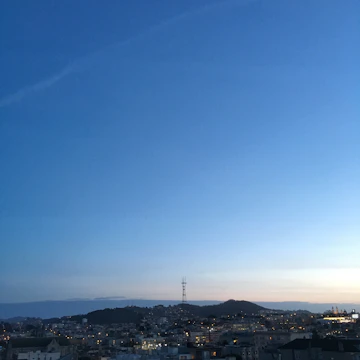 Panoramic view of a city skyline at dusk symbolizing global reach.