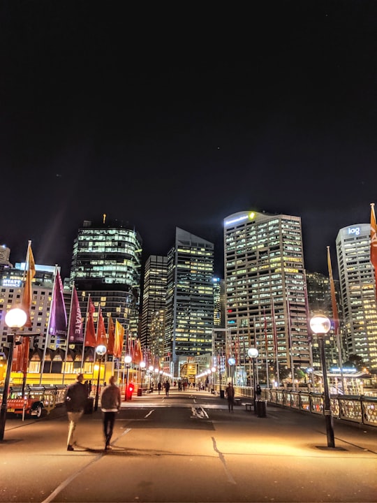 lighted high-rise buildings at night in Pyrmont Bridge Australia