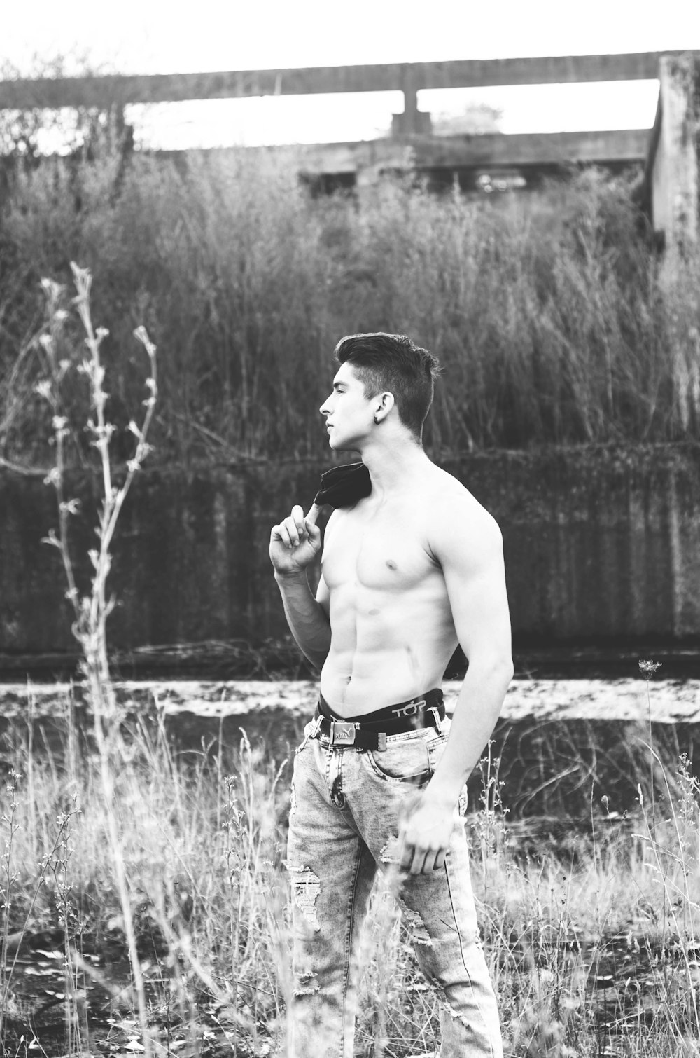 topless man grayscale photo