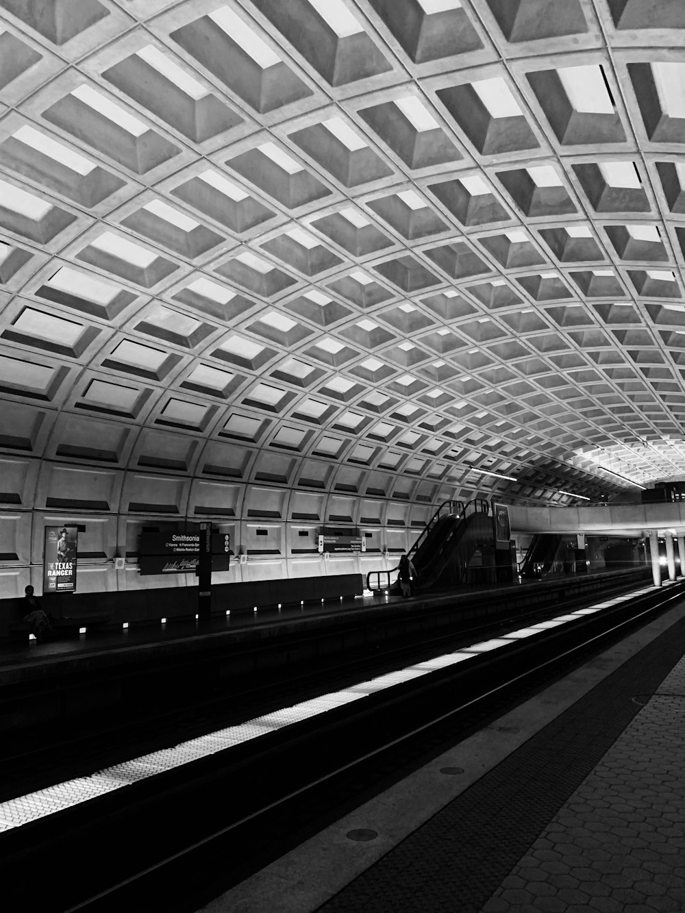 empty subway train station greyscale photography