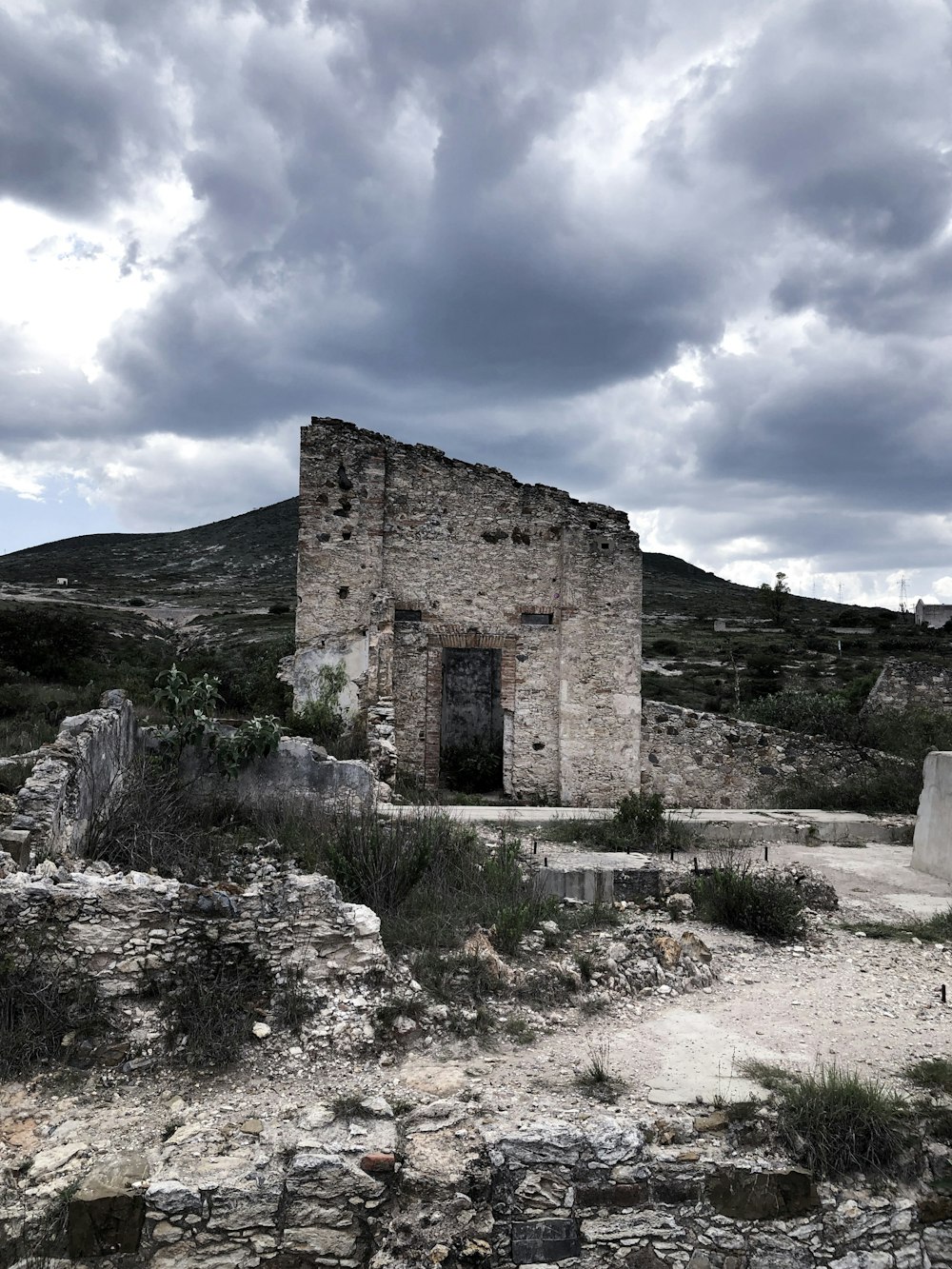 ruins under stratocumulus clouds