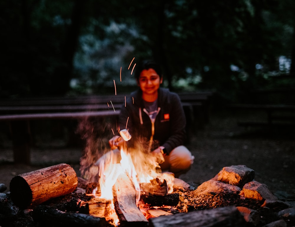 woman cooking marshmallow