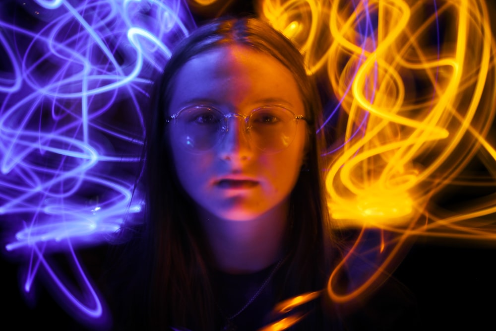 woman wearing gray-framed eyeglasses with wavy lights edited photo