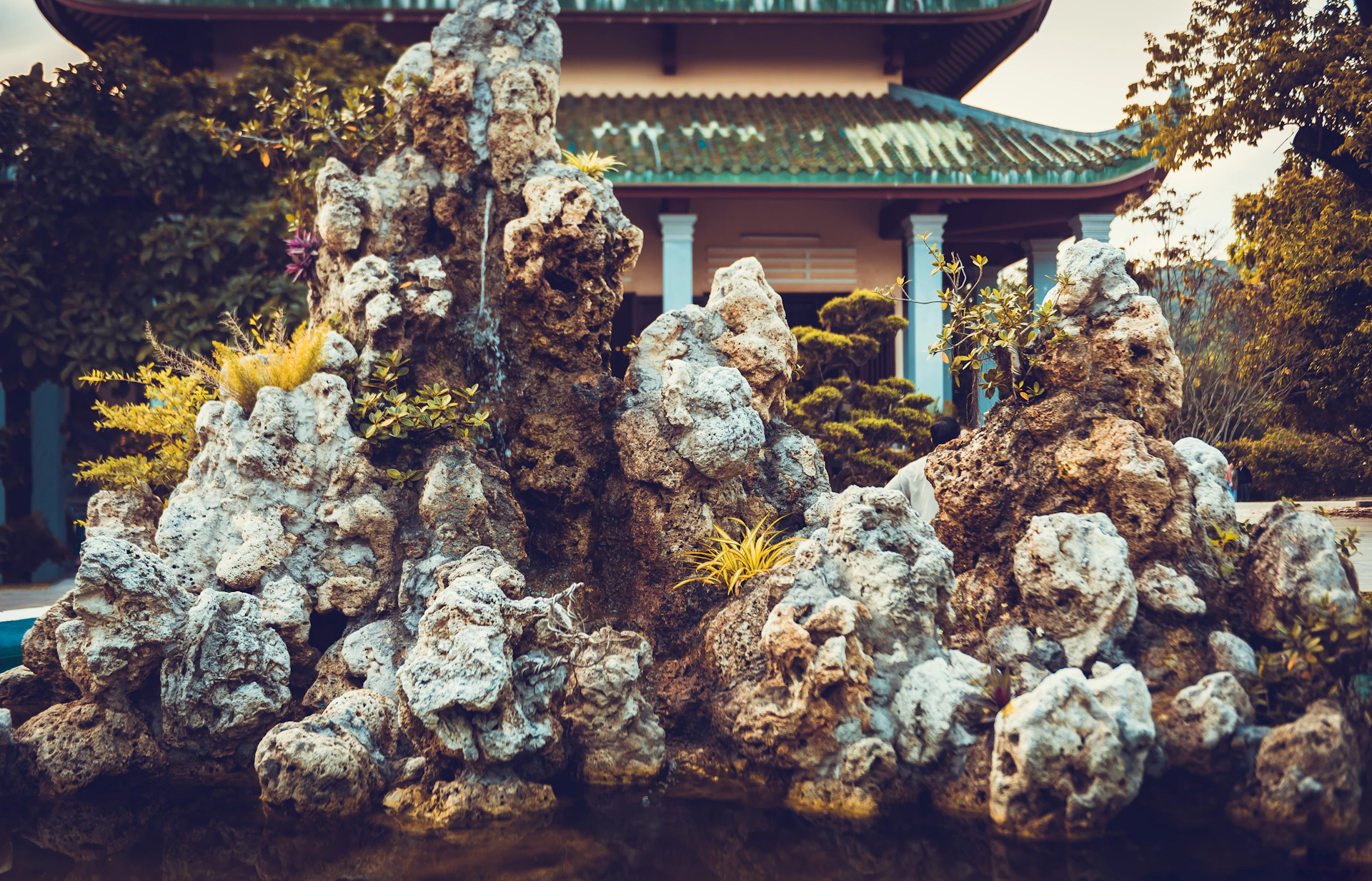 woman wearing yellow long-sleeved dress under white clouds and blue sky during daytime
