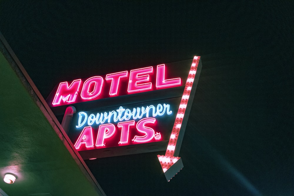 turned-on Motel Downtowner Apartments neon light signage