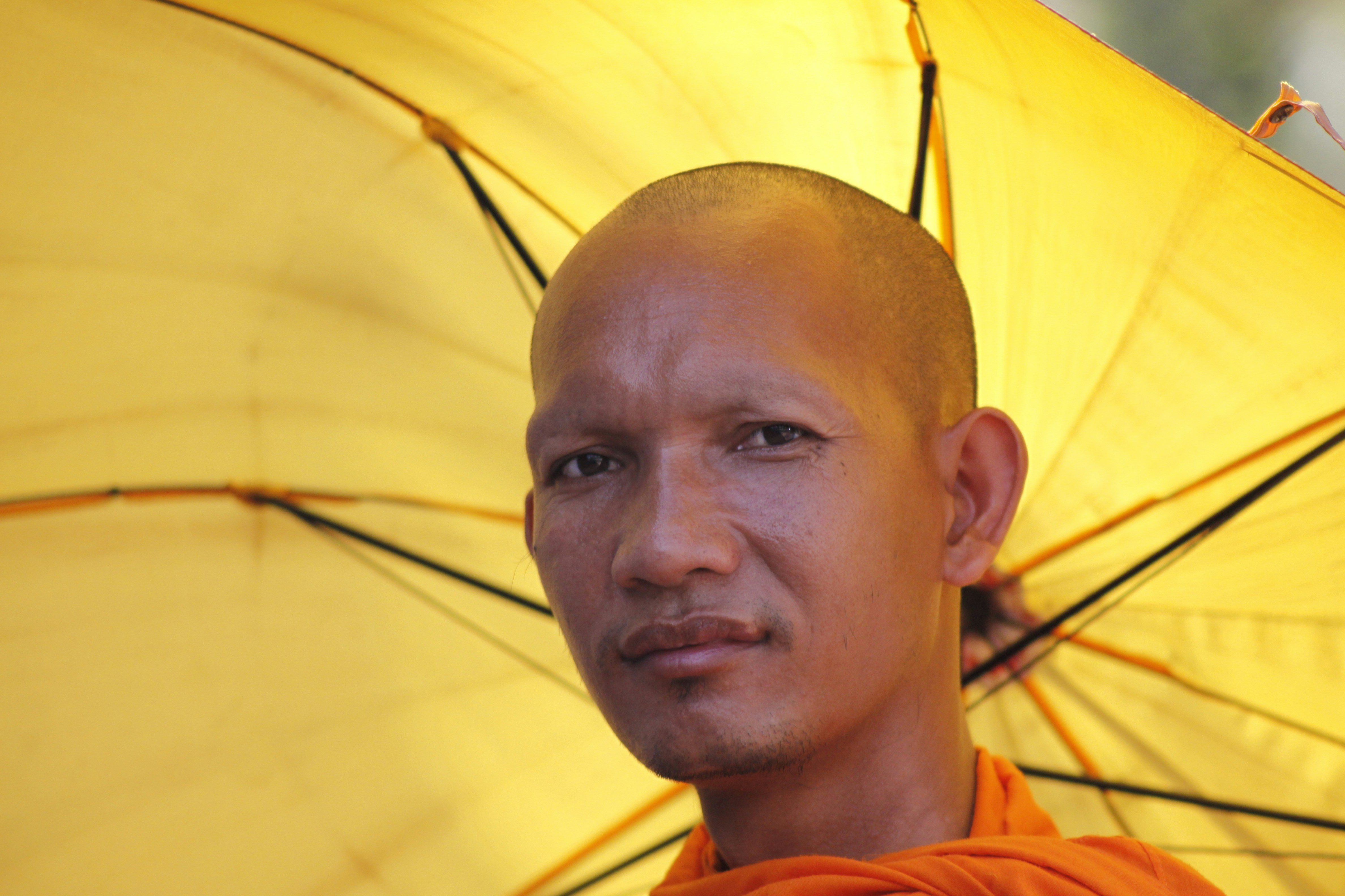 monk under umbrella