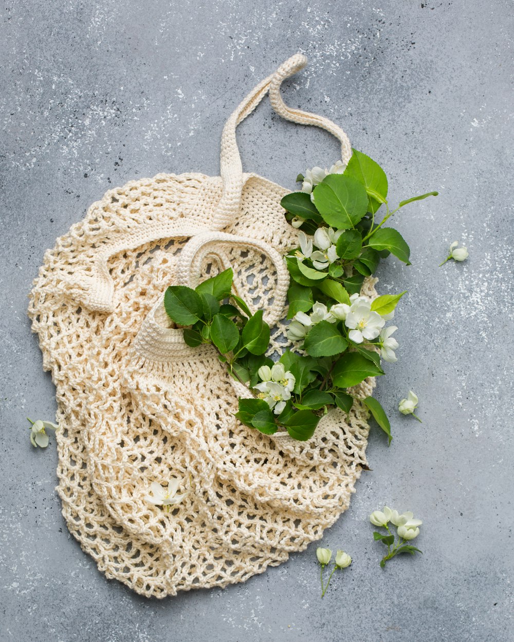 beige net bag with flowers