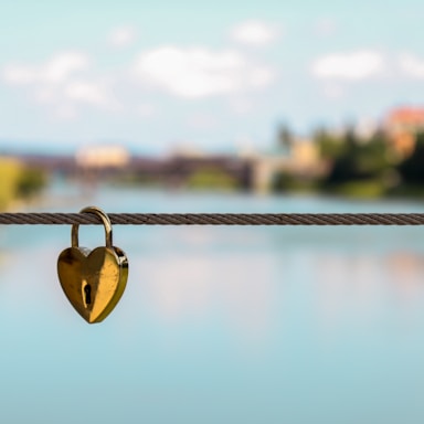 heart brass-colored padlock