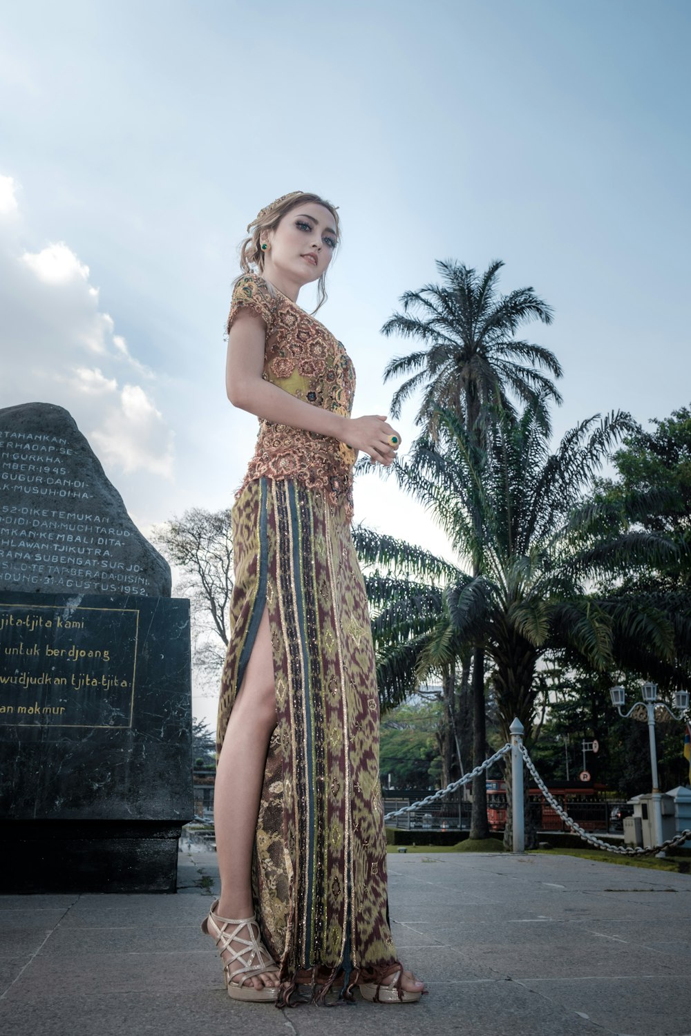 women's brown and green floral long dress close-up photography